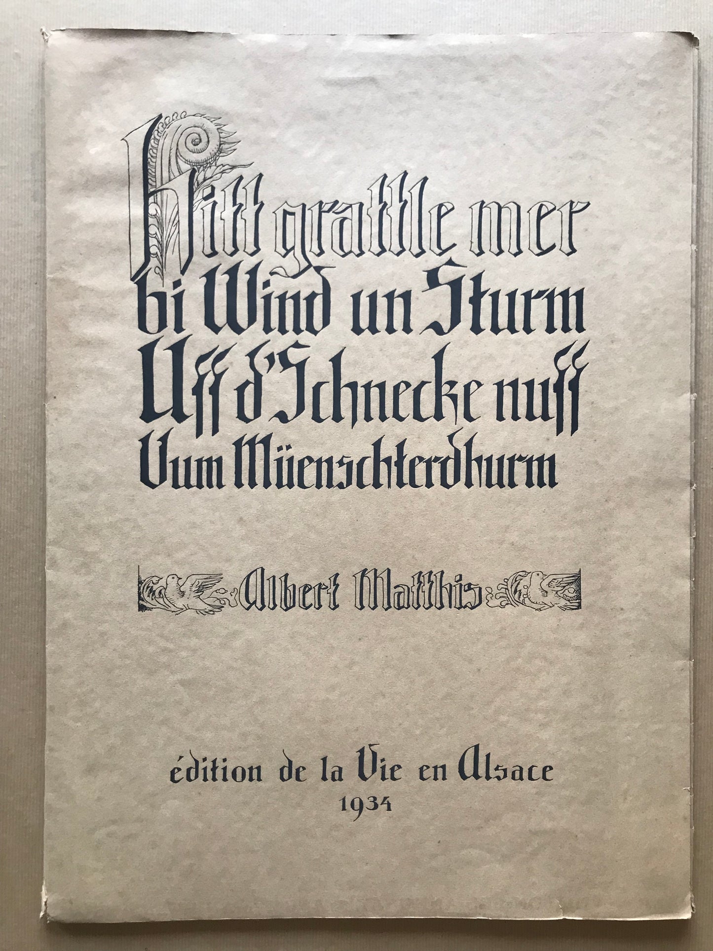Hitt grattle mer bi Wind un Sturm Uff d'Schnecke nuff Uum Müenschterdhurm - Albert Matthis - 1934
